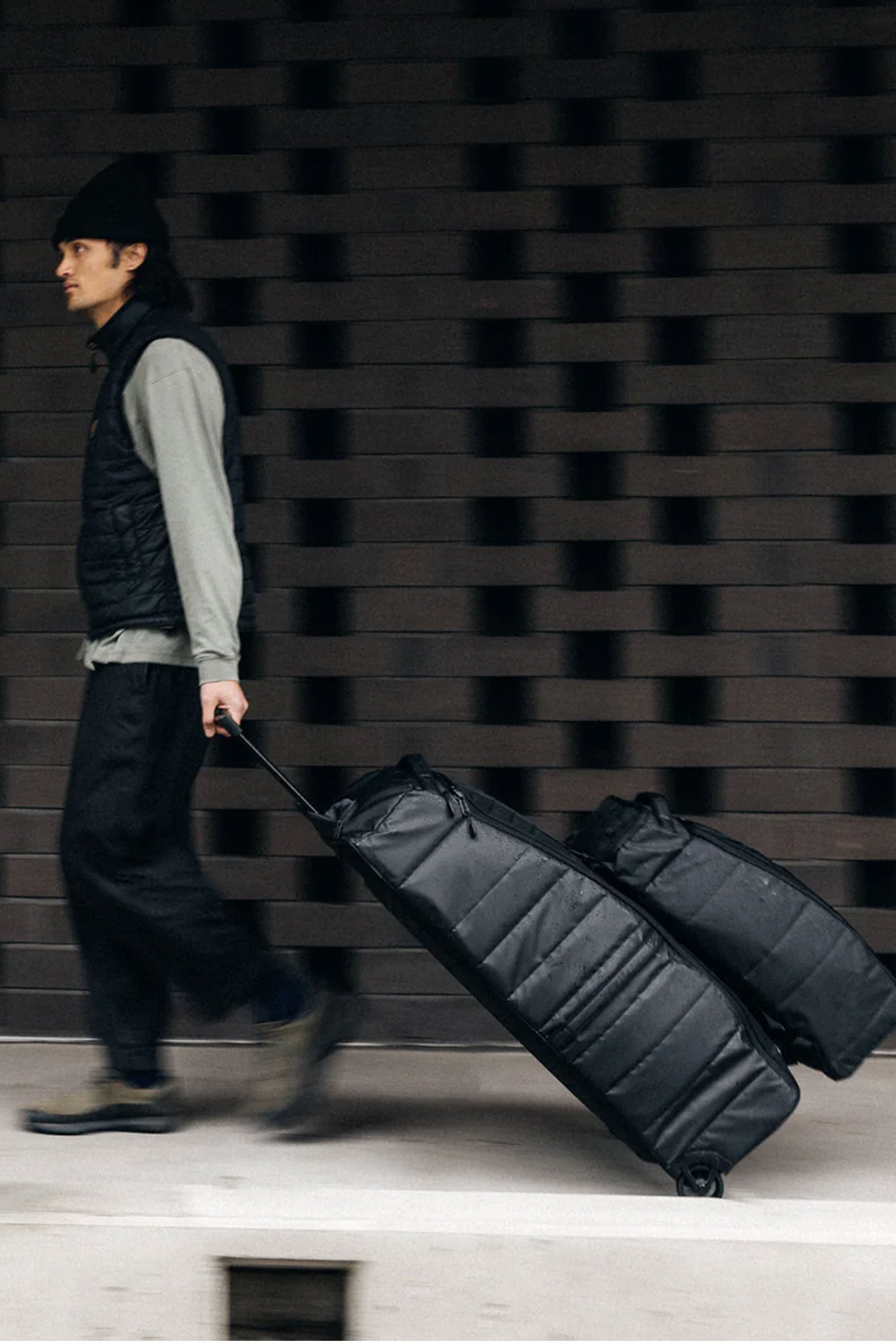 Pukas-Surf-Shop-Db-Journey-backpack-hugger-roller-bag-90l-black-out