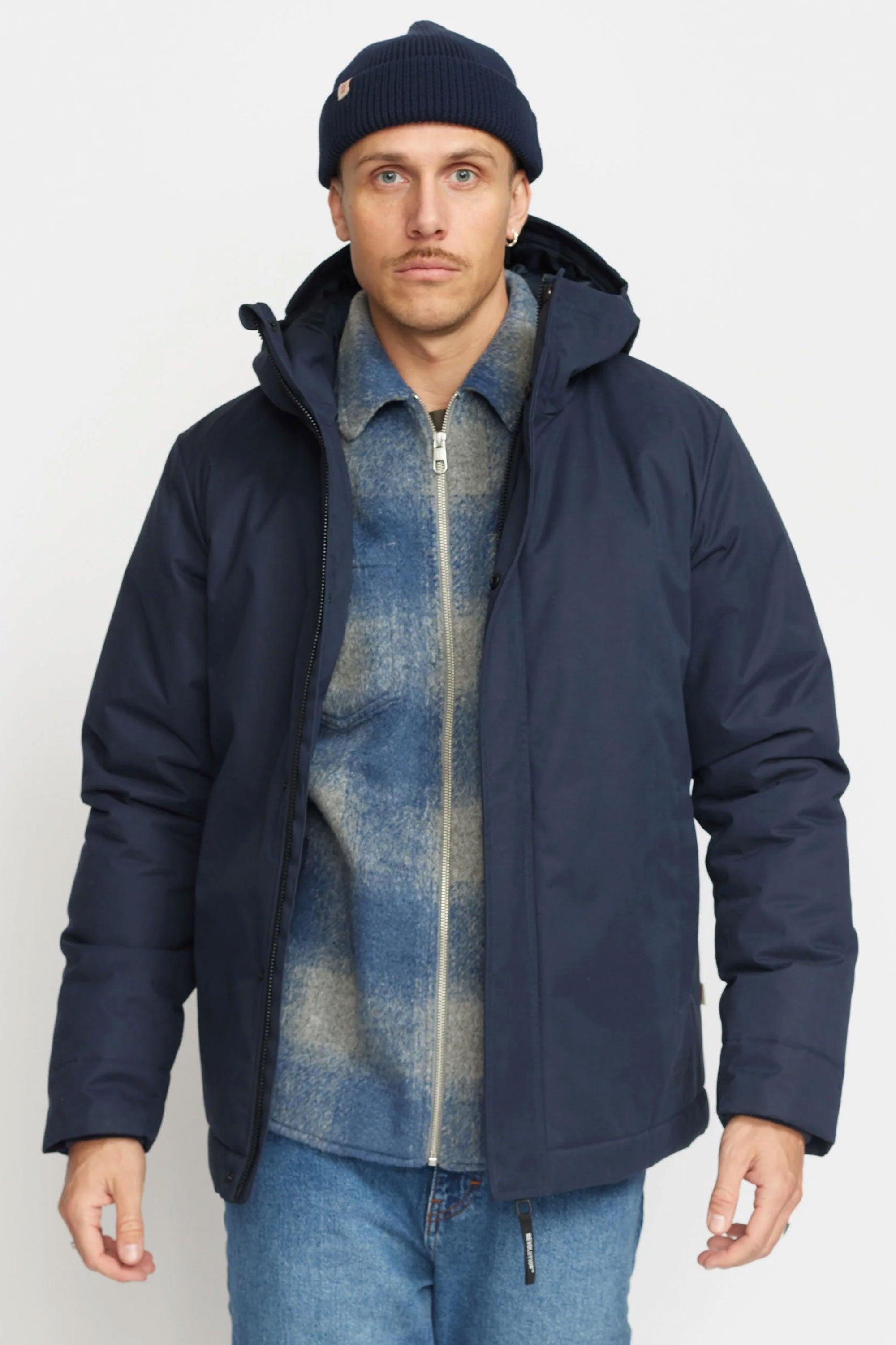 Man wearing a Revolution navy coat, denim shirt, and blue jeans Happylifeshops