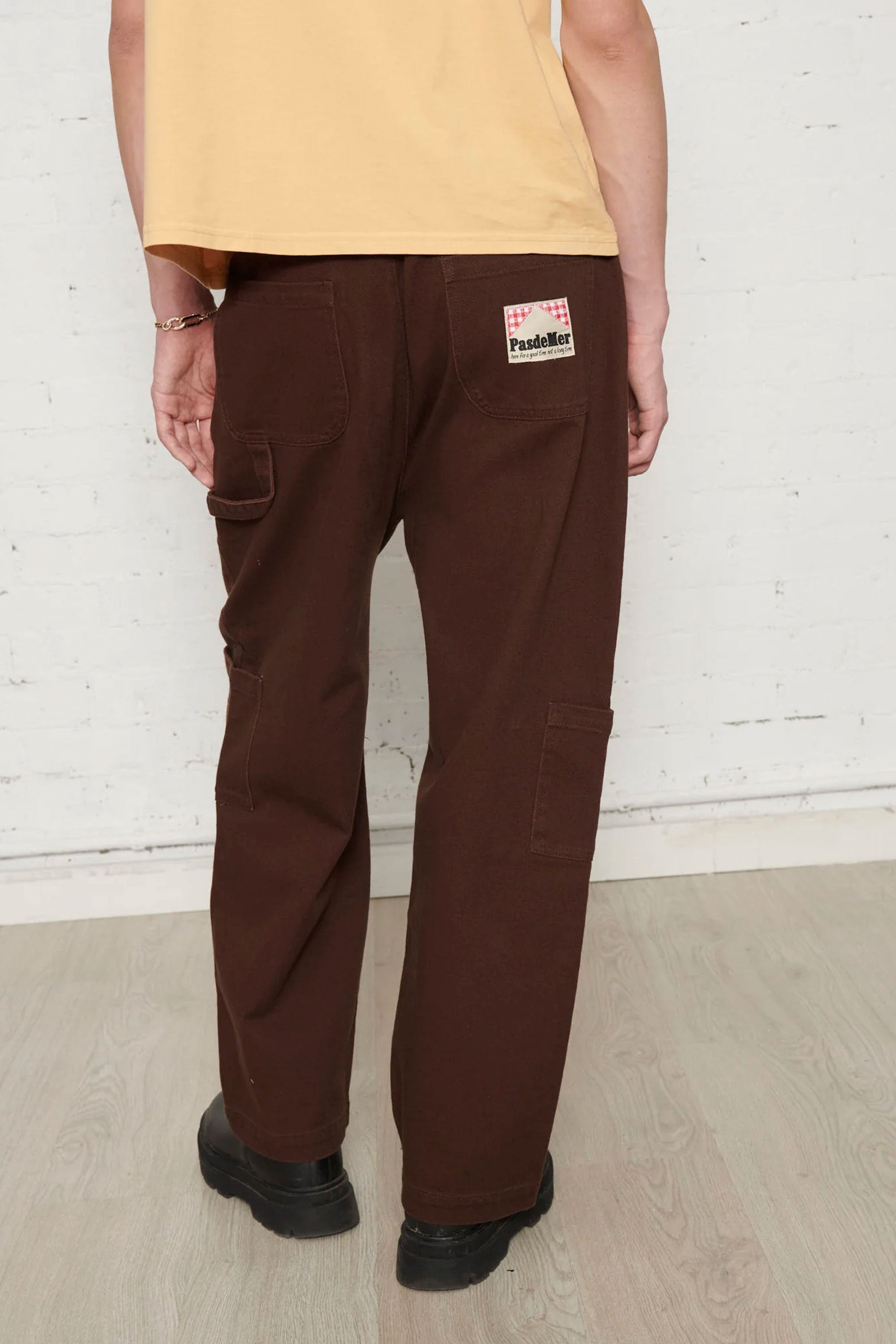Happylifeshops Pas De Mer Brown pants with a visible label on the pocket