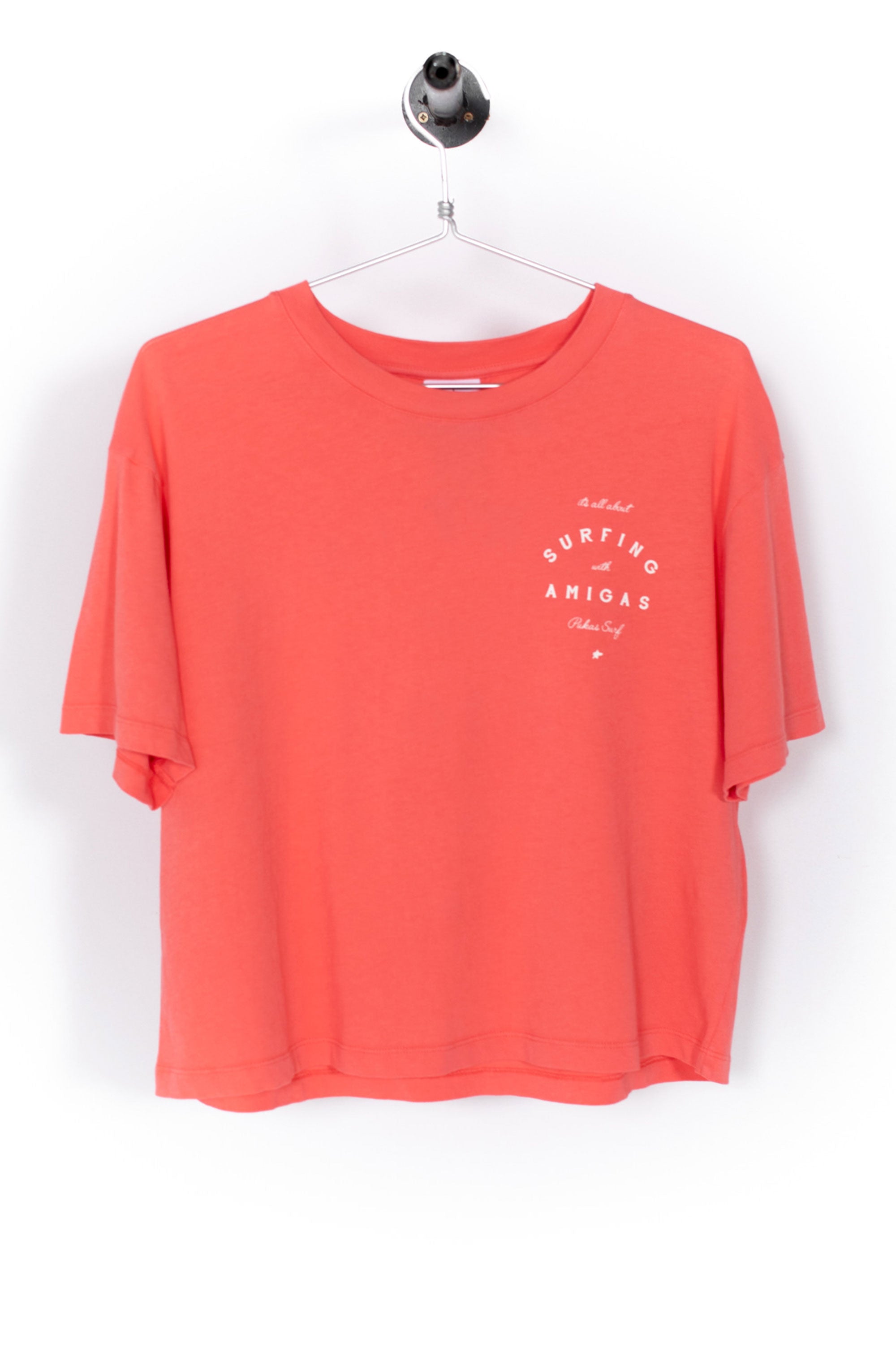 Coral t-shirt with a graphic design on a white background